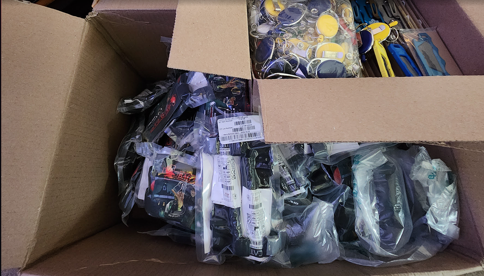 Medical and utility supplies prepped for Ukraine. 100 North American Rescue tourniquets and 100 GILTEK rugged utility knives.